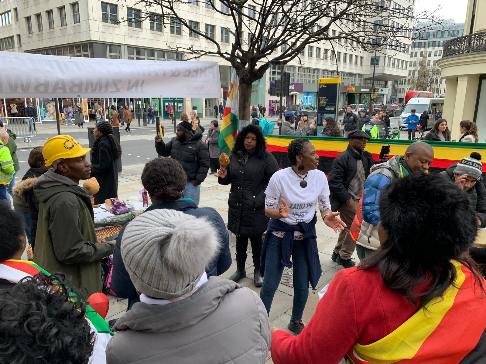 Rashiwe leading the protest song with voice and drum